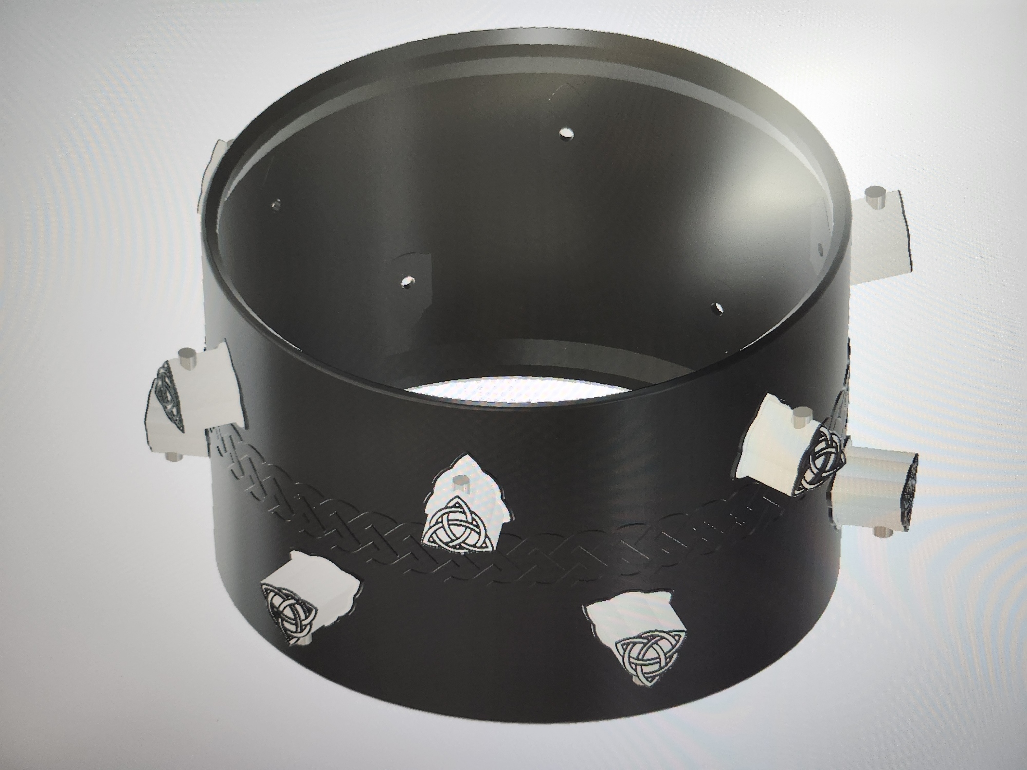 CAD design of the Falcon Drums tom shell with Celtic knot engravings and integrated lugs